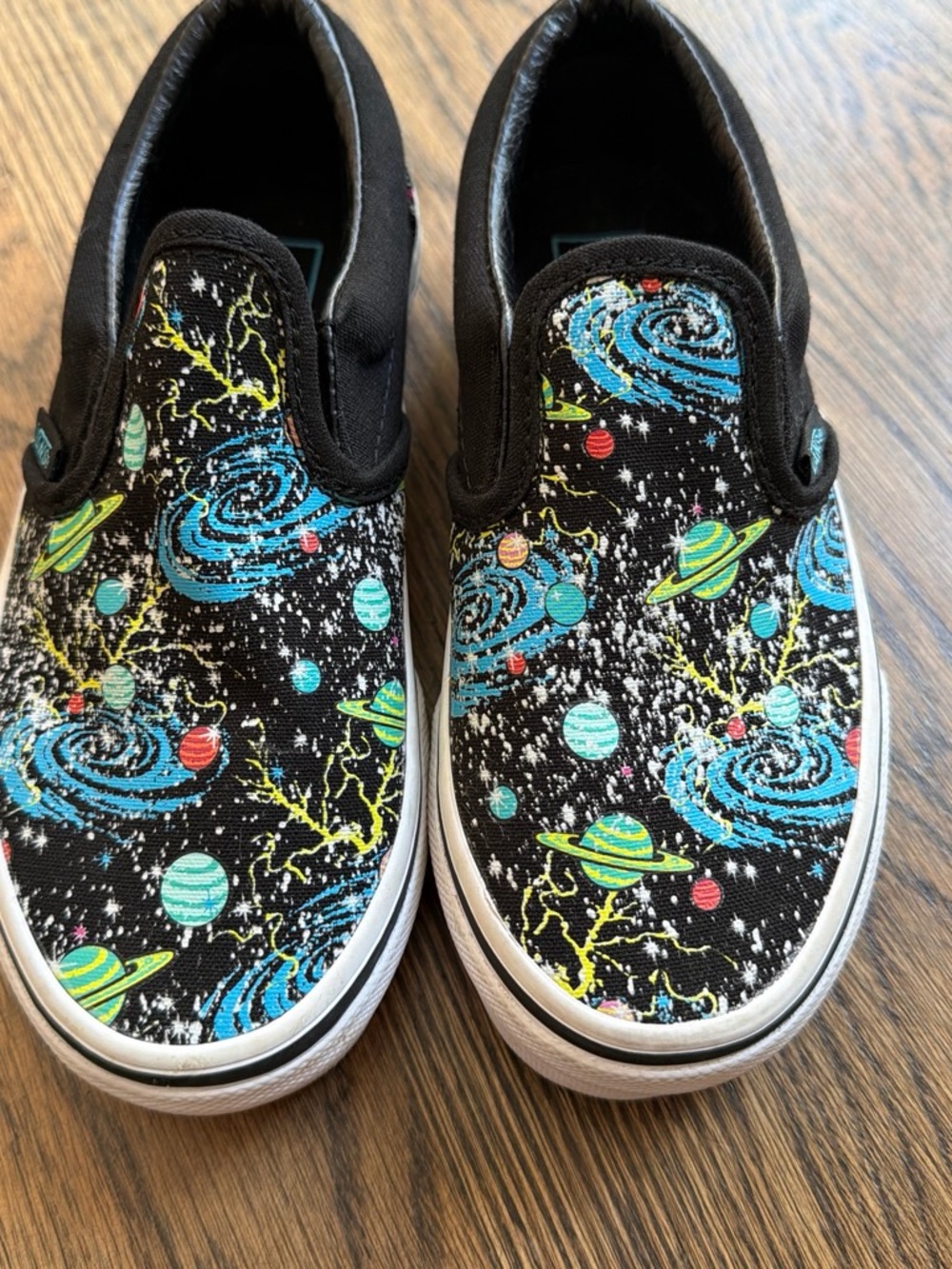 Vans Kids Slip-On Sneakers - Black with Blue, Green, Yellow & Red Planet Print